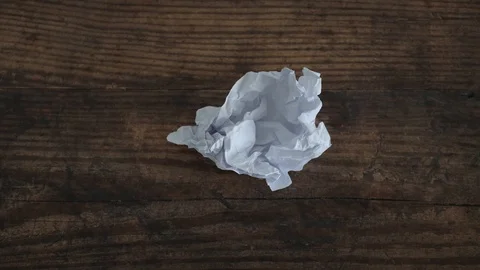 Creative block, timelapse with scrunched paper sheet flattening up and then g Stock Footage 118179337
