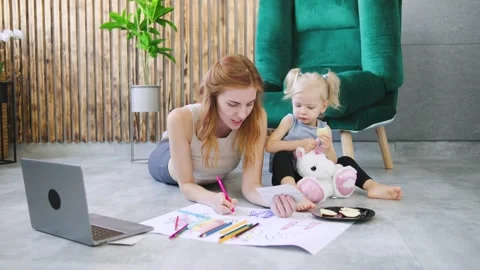 Creative bonding time between mother and daughter indoors with coloring Video stock 308489341