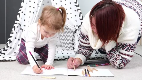 Creative bonding time with a child in a cozy home setting Stock-Footage 295353907