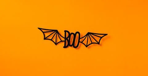 Creative Boo word phrase message text with bat wings on orange background Stock Photos