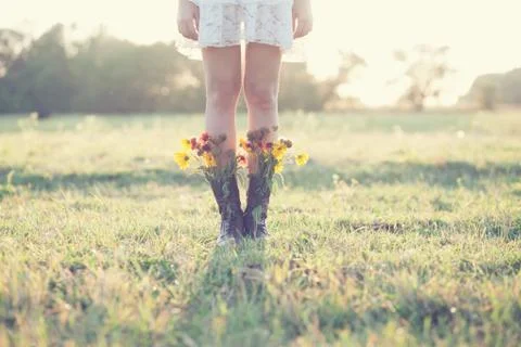 Creative bouquet in boots Stock Photos