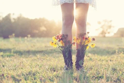 Creative bouquet in boots Stock Photos