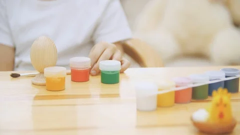 Creative boy is making craft, opening a red paint. Stock Footage 104639525