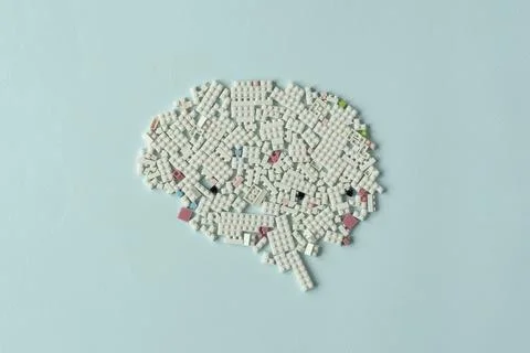 Creative brain shape made of white plastic blocks on pastel background Stock Photos