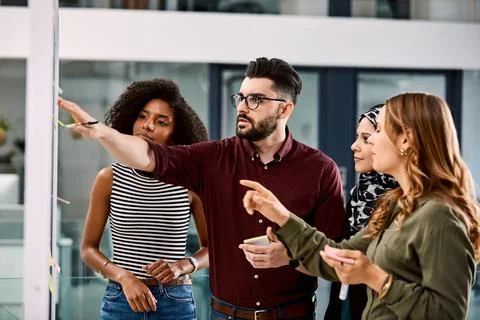 Creative, brainstorming and group with sticky notes in office, point or ide.. Stock Photos