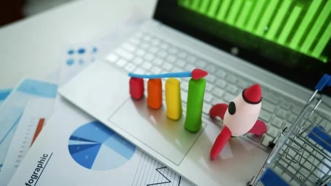 Creative Business Analysis with Clay Graph and Rocket Model, A laptop keybo.. Stock Footage 304881993