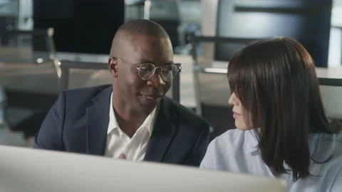 Creative business colleagues using desktop computer in office. Teamwork of two Stock Footage 205679345
