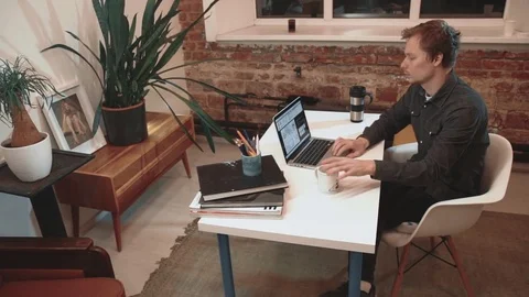 Creative Business Man working with laptop in his of his small business office Stock Footage 73601476