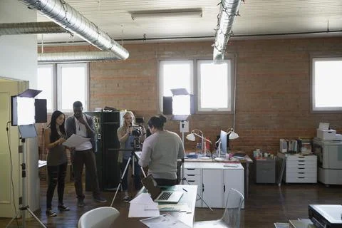 Creative business people filming tutorial Stock Photos