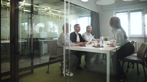 Creative business people, planning and brainstorming, view from glass wall. Stock Footage 334575592