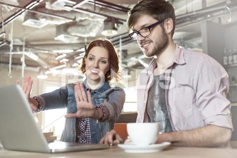 Creative business people working at laptop Stock Photos