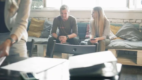 Creative business team is discussing something in business center during coffee Stock Footage 90481604