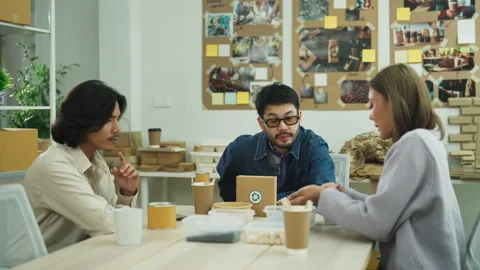 Creative business team evaluating eco-friendly design Stock Footage 300319949