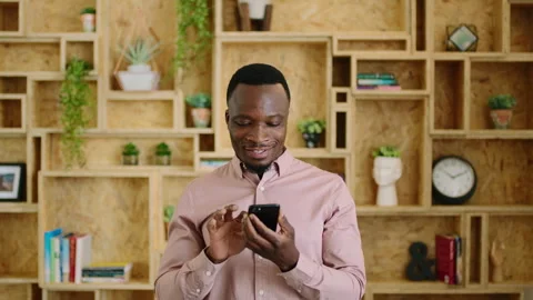 Creative, businessman and texting with phone in office, smile and reading post Stock Footage 336653472