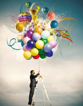 Creative businessman with colorful balloon explosion Stock Photos