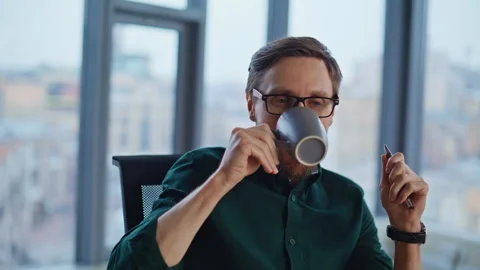 Creative businessman pondering ideas at office panoramic window closeup smiling Stock Footage 340305366