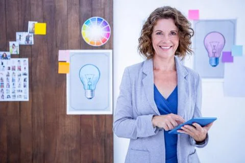 Creative businesswoman using tablet computer Foto stock