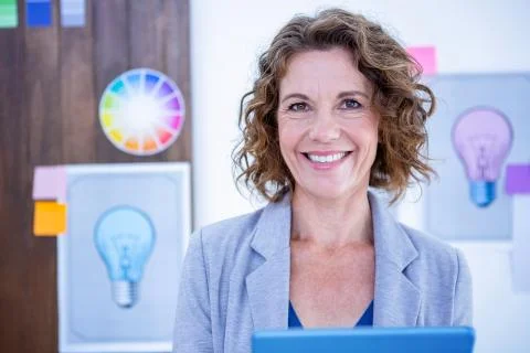 Creative businesswoman using tablet computer Stock Photos