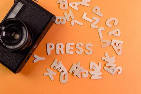 Creative camera setup with letters forming word press Stock Photos