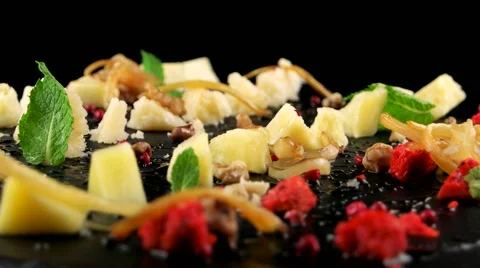 Creative cheese platter on the black stone tray Stock Footage 66482583