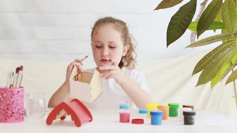 Creative child with a brush and blue paint Stock Footage 158172616
