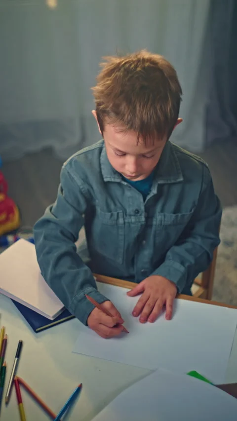 Creative Child Drawing at Home - Boy Using Pencils to Express Imagination Stock Footage 288633434