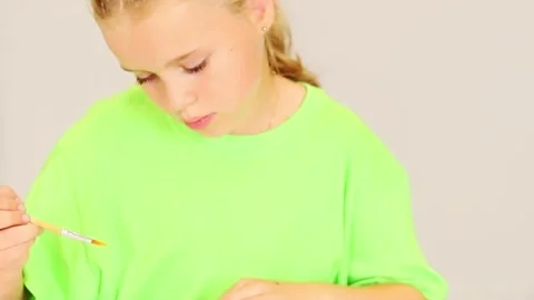 Creative child engaged in imaginative art project indoors Stock Footage 296332579