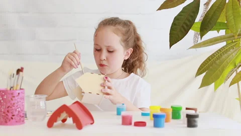 A creative child paints with blue paint Stock Footage 158172583