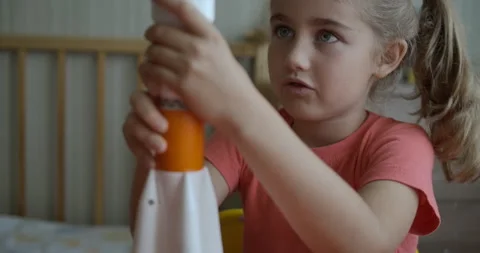 Creative Child Playing With Toy Space Rocket. Child Dreamer Playing With Toy Stock Footage 186411825