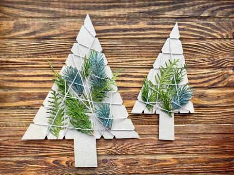 Creative for a child, simple crafts made of cardboard and spruce branches. Stock Photos