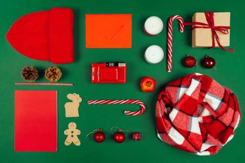 Creative Christmas collection of objects in red color isolated on green Stock Photos