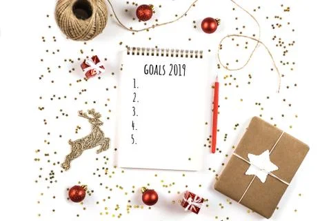 Creative Christmas composition with notepad and decorations. Stock Photos