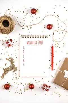 Creative Christmas composition with notepad and decorations. Stock Photos