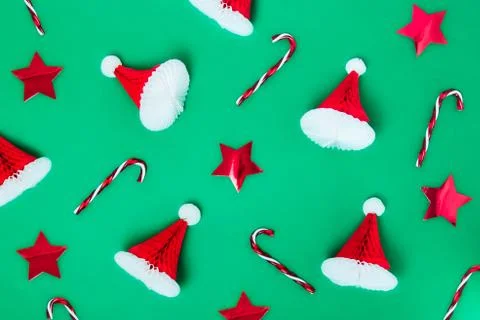 Creative christmas pattern background. Christmas candy canes, red stars and Stock Photos
