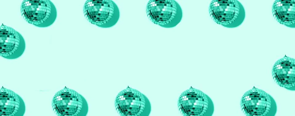 Creative Christmas pattern. Frame with shiny gold disco balls over mint Stock Photos