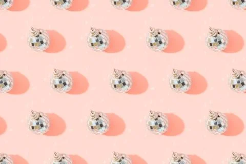 Creative Christmas pattern with shiny disco balls on pink. Retro party time Stock Photos