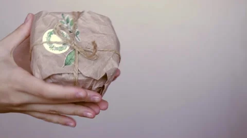 Creative christmas present in reusable eco friendly craft paper gift wrapping Stock Footage 165407139