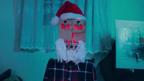 "Creative Christmas Robot Made from Cardboard – Glowing Santa Face" Video stock 299578036