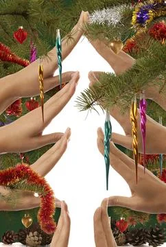 Creative Christmas tree made from hands on white background Stock Photos