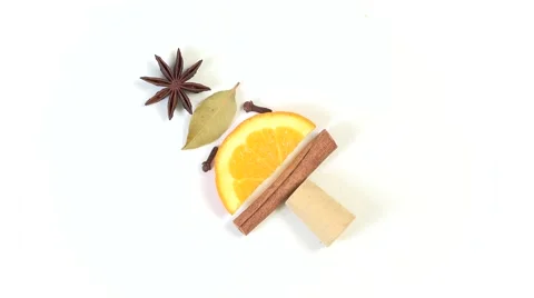 Creative Christmas tree made from slice of orange, cinnamon and condiments Stock Footage 67370631