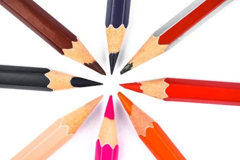 A creative circle made with many different color wood pencil crayons on a whi Stock Photos