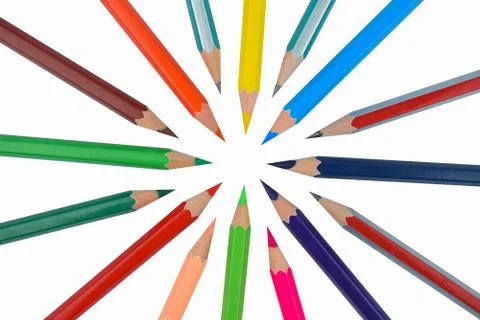 Creative circle made with many different color wood pencil crayons on a white Stock Photos