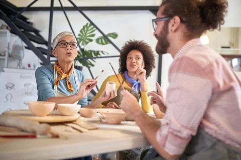Creative class of pottery having discussion .Creative, hobby ,workshop  conce Stock Photos