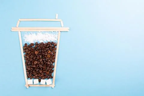 Creative coffee on a blue background. Stock Photos