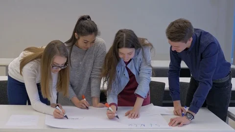 Creative college students making a project in a team Stock Footage 74613151