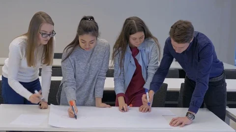 Creative college students making a project in a team Stock Footage 74613221