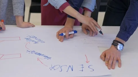 Creative college students making a project in a team Stock Footage 74613624