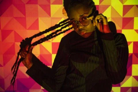 Creative colored pattern from projection light on beautiful women with dark skin Stock Photos