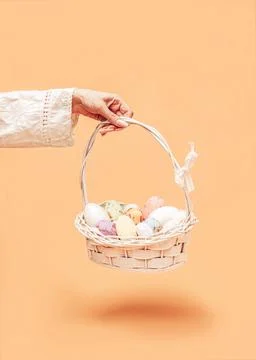 A creative colorful Easter idea. Composition of a white basket and colorful Stock Photos