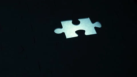 A creative completes the black or white light puzzle putting the last missing Stock Footage 220266018
